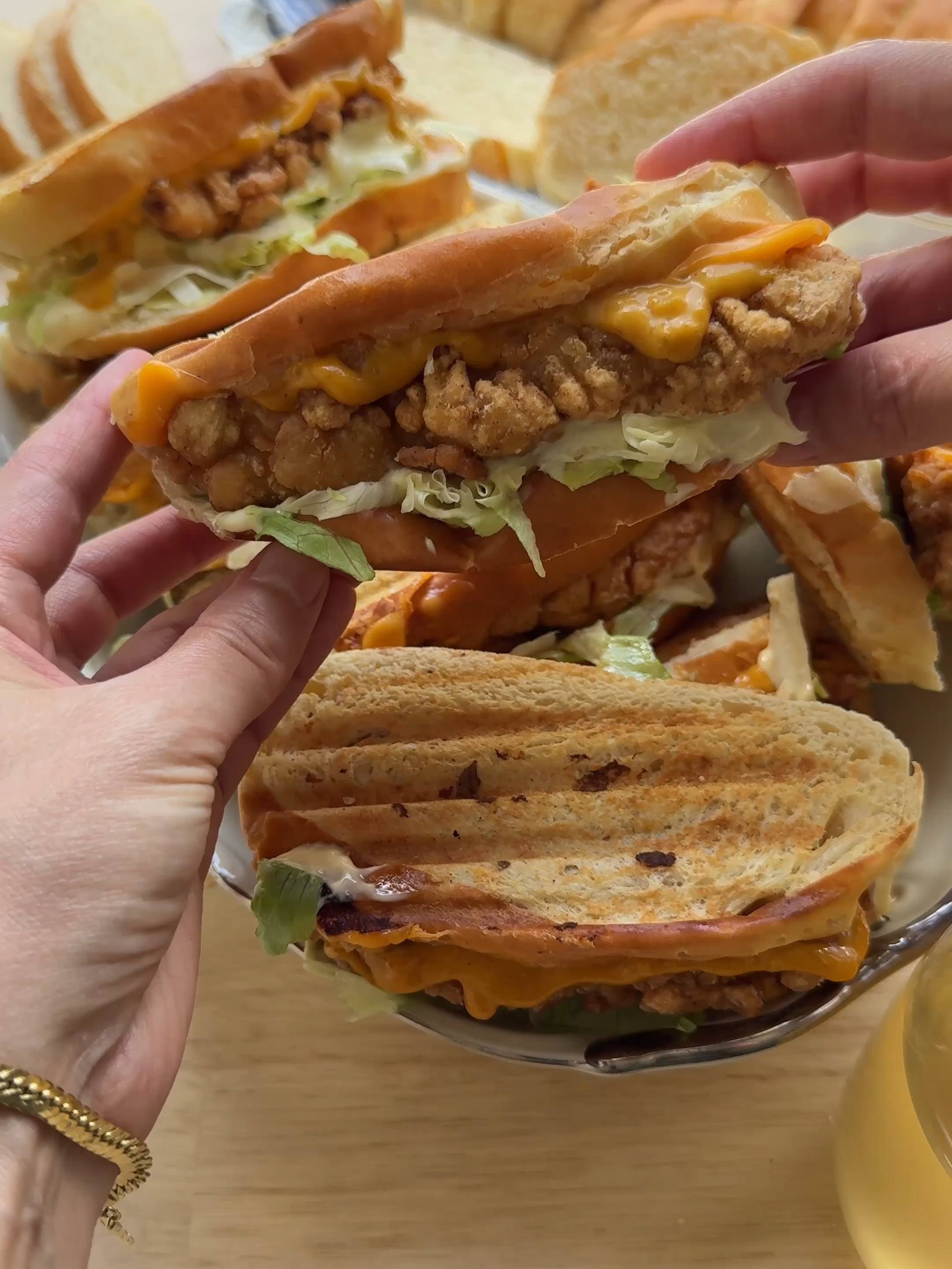 CRUNCHY CHICKEN SANDWICH   #food #recipe #chicken #sandwich #crunchy #tasty #fy #fyp #foryou #foryoupage   DOUGH 450 ml milk 12 g instant yeast 30 g honey 1 egg (medium) 800 g flour (all-purpose) 12 g salt (2 teaspoons) 55 g unsalted butter CHICKEN MIXTURE 700 g chicken breast 300 ml buttermilk 35 g hot chili sauce 6 g onion powder (2 teaspoons) 3 g cayenne powder (1 teaspoon) 2 g black pepper (⅔ teaspoon) 8 g salt (1⅓ teaspoon) 1 egg (medium) FLOUR MIX 175 g cornstarch 125 g flour (all-purpose or bread flour) 3 g garlic powder (1 teaspoon) 2 g black pepper (⅔ teaspoon) 4 g onion powder (1⅓ teaspoon) 3 g salt (½ teaspoon) TOPPING 1 egg (medium) Put the lukewarm milk, yeast, and honey in a large bowl. Mix well and let rest for 5 minutes. Add the beaten egg and mix. Add the flour, butter, and salt. Knead for 10–12 minutes until smooth. Cover and let rise for 1 hour, or until doubled in size. In a bowl, mix the buttermilk, hot chili sauce, onion powder, cayenne powder, black pepper, salt, and egg. Cut the chicken breast into slices and add them to the marinade. Cover and refrigerate for 30 minutes. In a separate bowl, combine the cornstarch, flour, garlic powder, black pepper, onion powder, and salt. Coat the marinated chicken in the flour mixture, making sure each piece is fully covered. Deflate the dough and divide into 2 equal pieces. Shape into balls. Roll one ball into a rectangular sheet. Tightly roll it up into a log and seal. Lightly roll with a rolling pin. Place the dough on a baking tray lined with parchment paper. Brush the tops with beaten egg. Make a few cuts on top and let rise for 30 minutes, or until doubled in size. Place the bread in a preheated oven at 200 °C (390 °F). Bake for 12–18 minutes, or until golden brown. Remove from the oven and immediately cover with a clean kitchen towel to keep them soft. Heat sunflower oil in a pan to 175 °C (350 °F). Fry the chicken on both sides until golden brown. Drain on paper towels. Slice the bread. Fill the bread with the crispy chicken, fresh vegetables, and a sauce of your choice. Briefly grill for extra flavor.