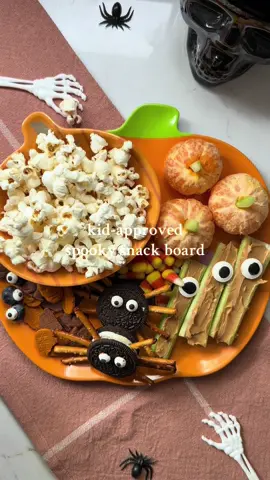 Kid-Approved Spooky Snack Plate - No tricks here—just the perfect mix of sweet + savory treats the kiddos will love! What’s on it: 🍿@LesserEvil Snacks  🕷️Oreo spiders (pretzel legs + candy eyes) 🎃Graham cracker pumpkins 🍬Classic candy corn 👁️Celery + peanut butter cyclops (candy eye on top!) 🍊Clementine pumpkins with a celery stem #lesserevilsnacks #charcuterieboard #lesserevilyum #bestpopcorn #lesserevilyum     