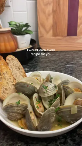 cooking is my love language👩🏽‍🍳 4 tablespoons unsalted butter 2 tablespoons olive oil 1 small-medium sized shallot chopped finely  2-3 large garlic cloves chopped finely 1 teaspoon red pepper flakes optional for heat  1 ½ cups white wine 2 pounds clams littleneck, or manilla clams, cleaned and scrubbed Juice of 1 lemon Small bunch of fresh parsley leaves roughly chopped Begin by heating a large skillet or pot over medium heat and add the butter and olive oil. Cook until the butter is almost fully melted. Add the chopped shallots and saute for cook for 2-3 minutes, until shallots just change color but not browned. Add in the garlic and red pepper flakes and cook for another 1-2 minutes, stirring everything together. Pour in the white wine and cook for another 30 seconds to 1 minute to reduce the wine slightly. Then add in the cleaned clams and give everyone one good stir. Cover the skillet or pot with a lid, leaving a small opening so the alcohol can cook off. Cook clams until they all just open, about 7-9 minutes. Once done, turn off the heat and add the fresh lemon juice and fresh herbs. Give everything one more good stir and serve with crusty bread  #cooking #Recipe #lovelanguage #clams #fyp 
