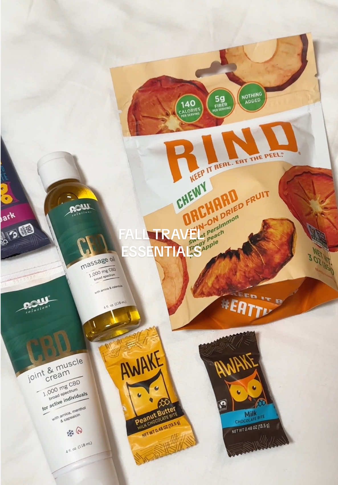 #ad My go-to fall wellness travel essentials ✈️ @NOW CBD Muscle & Joint Cream. They also offer a massage oil, which is perfect for self-care. A caffeine boost from @Awake Chocolate to power through the day (esp early morning flights), and a better-for-you snack from @RIND Snacks for those cozy fall vibes on the go. ✨ Deals you can grab: 🌿 NOW® Solutions CBD — 25% off thru 10/31 🍑 RIND Snacks — 20% off with code BabbleBoxx #FallWellnessBB2025 #fallfashionmusthaves #travelsnacks #travelessentials     