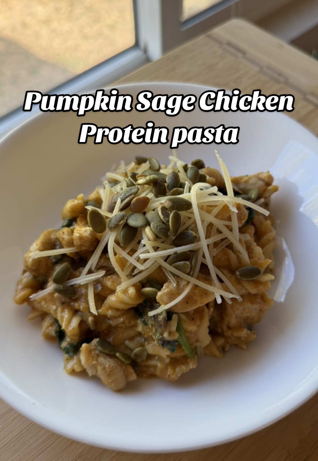 Recipe and macros below 👇🏼  🍂 Pumpkin Sage Chicken Protein Pasta Ingredients (4 servings): 8 oz high-protein pasta 1 lb ground chicken 1 cup pumpkin purée ½ cup plain Greek yogurt ½ cup chicken bone broth 3 cloves garlic, minced 1 Tbsp olive oil 2 tsp fresh sage, chopped ½ tsp nutmeg 2 cups fresh spinach 1 cup mushrooms, sliced Salt and pepper to taste Optional: parmesan and roasted pumpkin seeds for topping Instructions: -Cook pasta according to package directions until al dente. Reserve ½ cup pasta water, then drain. -In a large skillet, heat olive oil over medium heat. Add ground chicken, season with salt and pepper, and cook until browned. Remove and set aside. -In the same skillet, add garlic, mushrooms, and spinach. Sauté until softened. -Stir in pumpkin purée, Greek yogurt, chicken broth, sage, salt and pepper to taste and nutmeg. Whisk until smooth and creamy. -Return chicken to the pan, then toss in cooked pasta. Add a splash of reserved pasta water if needed for creaminess. -Taste and adjust seasoning. -Plate and top with parmesan and pumpkin seeds if desired. Macros per serving (4 servings): Calories: 472 Protein: 52g Carbs: 44g Fat: 11g #highproteinrecipes #fallrecipes #healthycomfortfood #macrofriendly #proteinpasta          