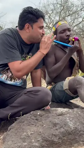“Colourful toy trumpet in the wild 🎺😅” “Our Hadzabe hunter friend was so curious about this toy trumpet 🤔🎺. First he found it weird and said ‘so colourful!’ 😂 But later he figured it out and started playing… haha, now we got a new musician in the tribe! 🎶🤣” ⸻ #HadzabeTribe #ToyTrumpet #CulturalExchange #FunnyMoments #LifeInTheWild