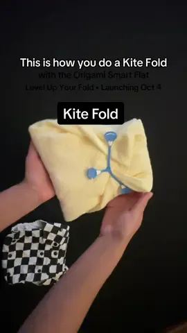 Level up your folds 🍼✨ The Kite Fold with the Origami Smart Flat™ gives a trim, customizable fit with absorbency right where you need it most. One flat, endless options. #clothdiapers #origamismartflat #kitefold #foldingtutorial #thegoodvillageclothco