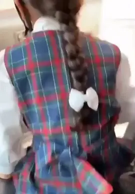 Girl happy as can be to go to school on her own