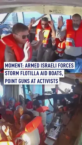 Israeli forces were seen boarding the Global Sumud Flotilla (GSF) and pointing their weapons at the crew who were kneeling with their hands up. The Israeli Forces intercepted the boats carrying aid to Gaza and detained the activists aboard, including Swedish climate campaigner Greta Thunberg. In one of the clips, one of the Israeli personnel was seen reaching for the camera filming the unfolding events. #Flotilla #Gaza #Aid #IDF #Soldiers #Sumud