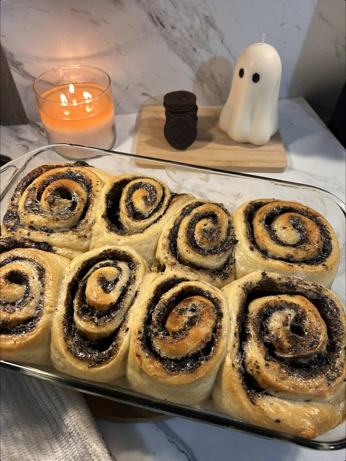 oreo cinnamon rolls 🖤 so fluffy & soft omgggg.    recipe: dough: 3/4 cup WARM milk(180ml) 1/4 cup melted butter(57g) 1/4 cup sugar(50g) 2 1/4 tsp yeast(7g) 1 egg & 1 yolk ( room temp ) 3 cups of flour(360g) 1/4 tsp salt(1g) 3 crushed @OREO    mix the warm milk with sugar & yeast and let sit for 5 mins to froth up. then add in your melted butter and eggs and mix. add your dry ingredients and knead until smooth. ( if your dough is too sticky add olive oil to your workplace & hands try not to add more flour, it keeps the dough fluffy instead of dense. )    let your dough rest covered for 1-1.5 hours, until doubled in size. roll out your dough.  filling:   1/3 cup melted butter(76g) 1/2 cup brown sugar(100g) 6-7 crushed oreos( about 1/2 cup ) 2 tsp cinnamon (8g) some crushed oreos to spread on top 1/4 cup heavy cream to pour over rolls  combine everything and spread on the dough, make sure to get the edges. i added too many oreos so my filling was a bit hard to spread, but i filled it in with crushed oreos !roll your dough up into however many rolls you want. ( i did 8 ) let rest for another 30 mins covered. pour heavy cream over top before baking at 350•F for 20-25 minutes. ( you may need longer, also if your rolls start browning before they’re done tent with foil ) let cool before adding icing.    cream cheese frosting:   2 tbsp soft butter (room temp)(28g) 4 oz cream cheese (room temp)(113g) 1 tsp vanilla bean paste(5g) 1 cup - 1 1/2 cup powdered sugar (120-180g)   whip butter and cream cheese until fluffy, then add in your vanilla and powdered sugar, continue whipping until you have your desired consistency. if it’s too thick add heavy cream, or even maple syrup :). spread over warm(not hot) rolls and enjoy :)    #oreo #cinnamonrolls #Recipe #baking #fyp    
