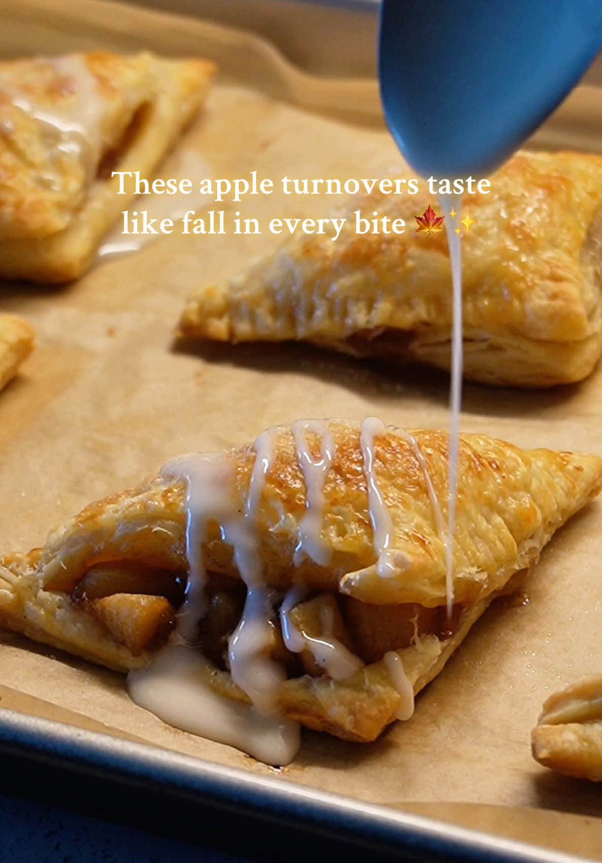 Flaky, golden, cinnamon-sugar apple turnovers 🍏✨ the coziest fall bake you need this season 🍁 #AppleTurnover #FallBaking #CozyRecipes #FoodTok #homemade  ✨Ingredients (makes 6–12 turnovers) 2 sheets puff pastry (thawed, store-bought works great) 3 medium apples (Granny Smith or Honeycrisp), peeled + diced 2 tbsp butter 2–3 tbsp brown coconut sugar (or regular sugar) 1 tsp cinnamon ¼ tsp nutmeg 1 tsp vanilla extract 1 tsp cornstarch (mixed with 1 tbsp water → thickener) 1 egg (for egg wash) Optional glaze: ½ cup powdered sugar 1–2 tbsp milk ½ tsp vanilla extract Instructions 1. Cook the apple filling In a pan, melt butter over medium heat. Add apples, sugar, cinnamon, nutmeg, and vanilla. Cook until apples soften (5–6 min). Stir in cornstarch slurry to thicken. Let cool. 2. Prepare pastry Cut puff pastry sheets into squares (~4–5 inches). Spoon apple filling onto the center of each square. Fold diagonally into a triangle and press edges with a fork to seal. 3. Bake Brush tops with egg wash (1 egg + splash of water), optional (sprinkle some sugar mixed with cinnamon on the top)  Place on a lined baking sheet. Bake at 350°F (176°C) for 18–20 minutes, until golden and puffy. 4. Glaze (optional) Mix powdered sugar, milk, and vanilla. Drizzle over cooled turnovers.