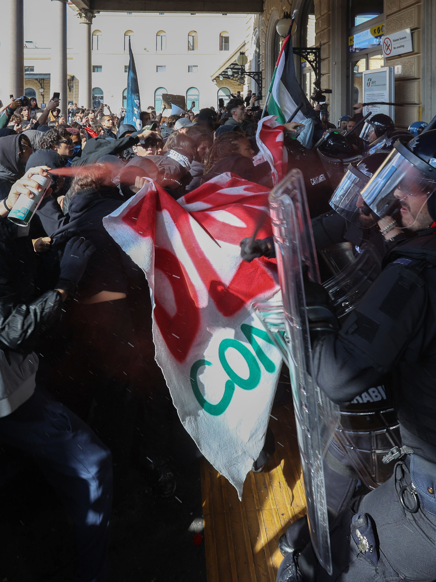Pro-Palestinian demonstrators clash with police outside Bologna Central Station in Italy
