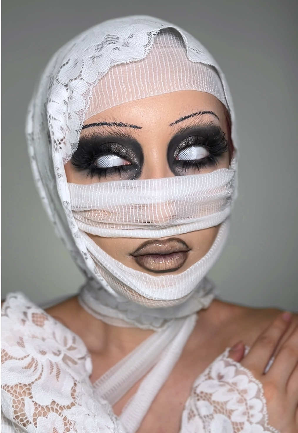 mummified 🧟‍♀️  products used:     @PinkyParadise colored contacts: use code alexluvs10 for 10% off and a free mystery gift! 🎁  @Elmer's US glue stick  @Morphe Cosmetics brightening pink setting powder, nude ambition palette, and contour stick  @elfcosmetics hydrating camo concealer  @UCANBE Official athena palette  @The Makeup Shack nutty brown lip liner  @maccosmetics lip erase light cool  @KISS Lashes iEnvy lash glue  @AlicrownLashes fox lashes  @Char Cosmetic lower lash clusters    #mummy #mummymakeup #halloweenmakeup #makeuptransformation #makeuptutorial 
