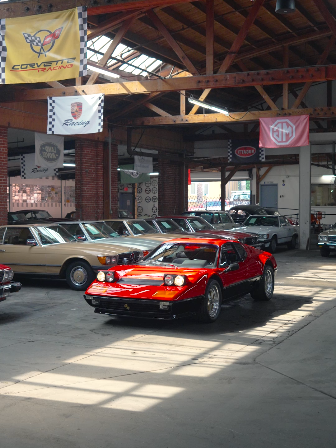 The 1983 Ferrari 512BBi Berlinetta Boxer is the final evolution of Ferrari’s legendary flat-12 flagship. The “i” stands for fuel injection, replacing carburetors to improve drivability and refinement. Under the rear deck sits a 4.9-liter flat-12 producing about 340 hp, paired with a gated 5-speed that gives mid-engine balance. Styled by Pininfarina, the 512BBi is wide, low, and beautifully restrained. Obvious clean wedge lines, pop-up headlights, and none of the excess of the later Testarossa. Just 1,007 examples were built between 1981 and 1984, making it a rare piece of Ferrari history. Brutal, elegant, and unapologetically analog, the 512BBi remains one of the most coveted Ferraris of its era. Welcome to Beverly Hills Car Club. #ferrari #vintage #racecar #car #sportcar #gt #sportscar #classic