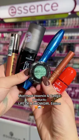 When your make-up matches the era 🩵 Which product would be YOUR showgirl essential? 👇   Our product must-haves for all the showgirls out there: 🧡 essence gel nail colour - 81 · tropic LIKE IT'S HOT 🍊 essence fix & LAST 18h LONG-LASTING MAKE-UP FIXING SPRAY 👠 essence COLOUR it! metallic liquid liner - 01 · Burnished Bronze 💄 Catrice Space Glam Chrome Eyeshadow - 060 - Galactic Glow 🎤 Catrice Glam & Doll Volume Mascara Waterproof ✨ Catrice Plump It Up Lip Booster - 070 - Fake It Till You Make It   #essencecosmetics #catrice #makeup #showgirl #era 