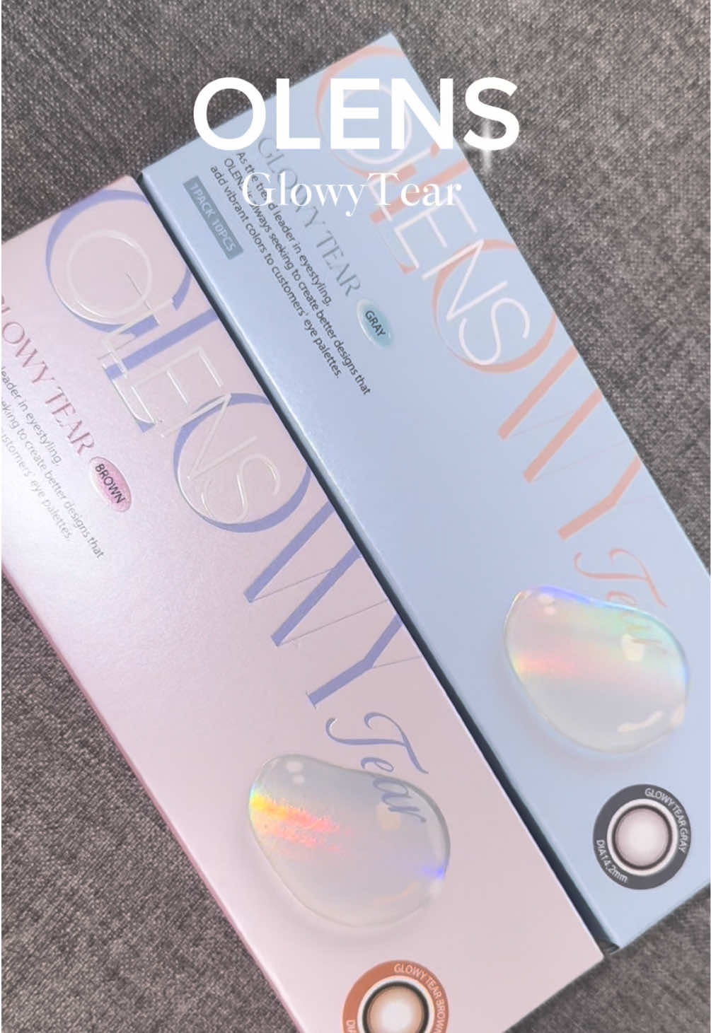 OLENS GlowyTear	
 カラー：グレー、ブラウン
 レンズ直径：14.2mm
 着色直径：13.3mm
 レンズBC：8.7mm
 
 韓国で爆売れしてるナチュ盛れカラコン💓
 新発売の商品で大人気🫶 水光レンズでうるっと見せてくれるから うるっと可愛く盛れるのが嬉しい🥰 限定クーポンコード【fhf8j】を入力すると、 今だけモアコンでお得に購入できるよ 期間：～2025/10/31 23:59 クーポン：1箱ご購入で25％OFF 対象：OLENS全カラー 制限：使用回数無制限 @olens_jp #PR #ad #OLENS #うるぷるカラコン  #モアコン