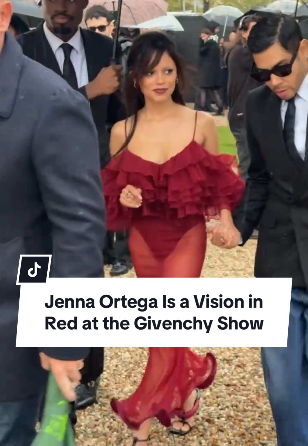 Even the rain can’t stop #JennaOrtega from serving looks at the @Givenchy show. #TikTokFashion 