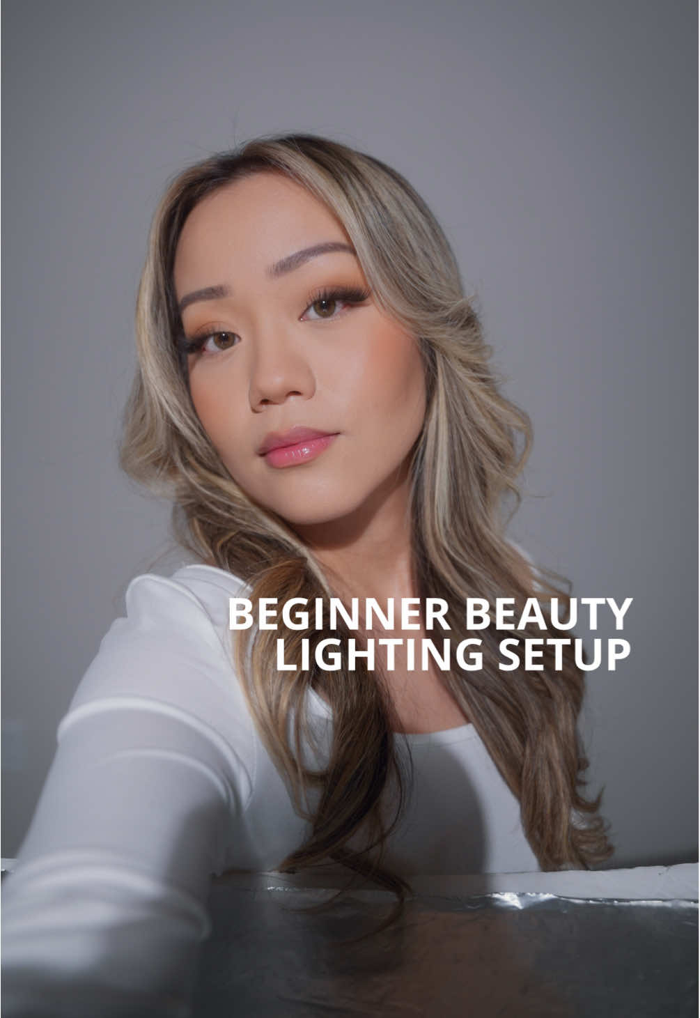 Beginner Beauty Lighting Setup 💡 Two things you’ll need for this setup: an LED light and a reflector. This lighting setup is simple and beginner friendly. I’m using a single @Godox Official SL60W with its standard reflector as my key light, positioned directly in front and slightly above me. To lift shadows and create beautiful catchlights, I’ve placed a reflector under my chin. Stunning results that compliment beauty videos really well 😍 #lighting #studiolighting #filming #ugctips #creatortips #godox #beautycontent #beautyvideo #behindthescenes #godox #godoxlighting