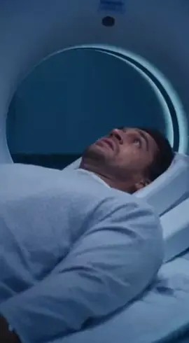 A dramatic hospital MRI room scene at night: A male patient in his 30s, wearing a hospital gown, lying inside a powerful MRI machine during a scan, eyes wide with shock. Suddenly, due to the nurse's negligence, a young female nurse in blue scrubs standing nearby is violently pulled toward the MRI machine by its intense magnetic field — her metal clipboard, stethoscope, and scissors flying off her body mid-air, hair whipping wildly, expression of pure terror. The MRI machine's powerful magnetic pull distorts metal objects around the room — IV poles bending, chairs sliding across the floor. Emergency red lights flashing, sparks flying from the machine, control panels glitching. Cinematic lighting, high contrast, realistic physics, photorealistic, ultra-detailed, 8k, horror medical thriller vibe --ar 16:9 --v 6 --q 2#creatorsearchinsights#MRISafety #Magnetichorr #MRI #hospital @UNITED STATES 
