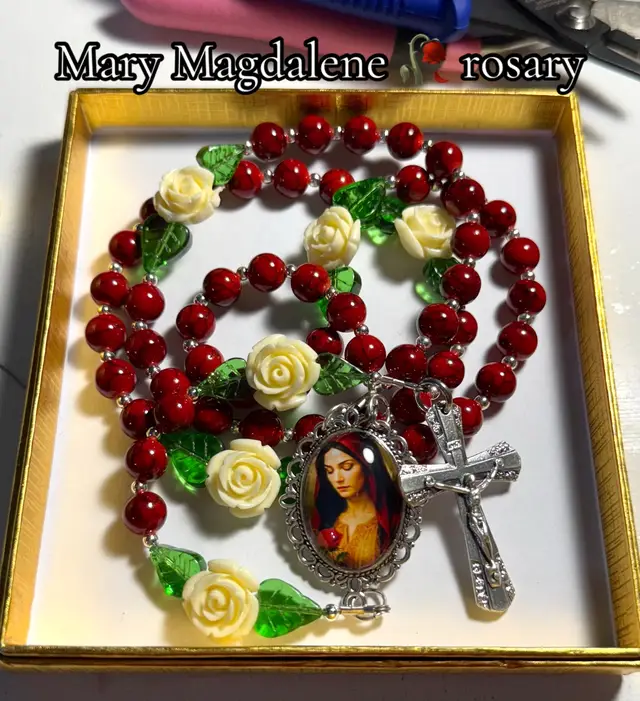 This Mary Magdalene rosary is one of the most special pieces I’ve ever created. The red beads symbolize her unwavering love for Christ, the roses reflect her transformation and purity of heart, and the green leaves represent hope and renewal. Mary Magdalene reminds us that no matter our past, we are endlessly loved, forgiven, and called by name. She was the first to witness the Resurrection, the first to run and proclaim the Good News ✨🤍 #rosary #marymagdalene #catholictiktok #prayer #catholicism 