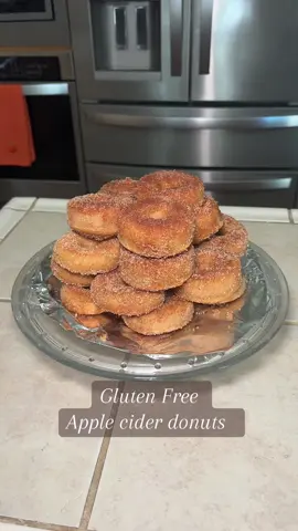 Baked, Healthier, Gluten free apple cider donuts with a cinnamon sugar coating                             INGREDIENTS 1 and 1/2 cups apple cider 2 cups gluten-free flour 1 teaspoon baking soda 1 and 1/2 teaspoons ground cinnamon 1/2 teaspoon nutmeg 1/4 teaspoon sea salt 2 tablespoons, coconut oil or butter, melted 1 egg, room temperature 1/2 cup sugar 1/2 cup maple syrup 1/2 cup lactose free milk, room temperature 1 teaspoonish vanilla extract Topping 1 cup sugar 1 and 1/2 teaspoons cinnamon 1/2 teaspoon nutmeg 6 tablespoons dairy-free butter, melted INSTRUCTIONS This recipe starts with reducing the apple cider.Place the apple cider in a saucepan and bring to a boil over medium-high heat, then reduce the heat to medium and let the apple cider continue to cook until it reduces down to 1/2 cup. This could take 15-30 minutes. Keep a liquid measuring cup nearby to pour the apple cider in to check on the amount. If it’s still over 1/2 cup, pour it back into the saucepan and continue cooking. Once it’s at 1/2 cup, set it aside to cool or put it in the refrigerator. While you are reducing the apple cider, you can measure out the milk to bring it to room temperature as well as the egg, then melt the 2 tablespoons of butter and let it cool. Preheat the oven to 350°. Prepare two donut pans by greasing them with non-stick spray. I like to use melted coconut oil. Make the donuts: Whisk together the gluten-free flour, baking soda, cinnamon, nutmeg, and salt in a large bowl.  Whisk the egg, melted dairy-free butter, maple syrup, white sugar, milk, and vanilla in a small bowl. Pour the wet mixture and the reduced apple cider into the dry ingredients and mix until combined. Next, take a gallon-sized zip-top baggie and fold down the top to the outside twice. If it will stand on its own, that’s a win, but if not, hold onto it with one hand and dip the batter into the baggie. Then, gather the top of the baggie together and cut a little corner off the bottom of the bag. Use the baggie to pipe the batter into the donut pan. Bake for 11-13 minutes. The donuts should be golden brown and bounce back after tapping your finger on top of the donut. Let the donuts sit in the muffin pan for 2 minutes, and then remove the donuts to a wire rack. Coat the donuts: Melt the 6 tablespoons of butter in a small pan. And in a shallow bowl, mix together the sugar, cinnamon, and nutmeg. Once the donuts are cool enough to hold, dip both sides of the donuts into the butter. Then, dip both sides of the donuts into the sugar mixture. Place the donuts on a wire rack to cool.  Found on Pinterest originally by Robin Brookshire, but adjusted to fit my families needs and what we had 🫶🏽