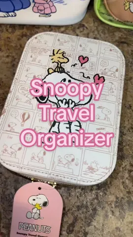 Peanuts™ Snoopy Travel Organizer with LED Mirror Faux Leather Case for Beauty Essentials & Jewelry USB-C Rechargeable with Tri-tone Lighting is a compact yet spacious travel organizer designed to keep makeup, skincare, and jewelry neatly organized on the go, featuring officially licensed Peanuts Snoopy artwork, a durable faux leather exterior with silver hardware, a built-in LED mirror with adjustable tri-tone lighting for cool, warm, or natural light, soft-touch sensor controls with dimming, and smart interior compartments with dividers for lip gloss, earrings, brushes, and daily beauty essentials, making it a practical and stylish travel makeup case, cosmetic organizer, and jewelry storage solution for Snoopy fans, Peanuts collectors, and anyone who wants a cute, functional, and travel-friendly beauty organizer. #tiktokshopcreatorpicks #tiktokshopholidayhaul #newfunpicks #snoopy #impressionsvanity @Impressions Vanity 