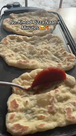 Pizza Naan (No-Knead) Ingredients 	•	Warm water: 130 g (½ cup + 1 tbsp) 	•	Dry yeast: 1 tsp 	•	Sugar: 1 tbsp 	•	Yogurt: 143 g (⅔ cup) 	•	Flour: 265 g (2 cups + 2 tbsp) 	•	Salt: 1 tsp 	•	Oil: 2 tbsp ⸻ Instructions 	1.	In a bowl, mix warm water, yeast, and sugar. 	2.	Add yogurt, flour, oil, and salt. Mix with a spoon until a dough forms. Cover the bowl and place it on top of another bowl filled with hot water to speed up fermentation. Leave it for 1 hour. 	3.	Flour your surface very well, then divide the dough into 4 pieces. 	4.	Gently stretch each piece from the sides. 	5.	Heat a non-stick pan over medium-high heat. Place the naan in the pan and cook 1 minute. 	6.	Flip it, cook briefly, then flip again. Add pizza sauce, jalapeño, cheddar, mozzarella, and dust with thyme. 	7.	Cover with any lid you have so the cheese melts. Do not cook too long. #naan #pizza #bread #breadtok #homemade 
