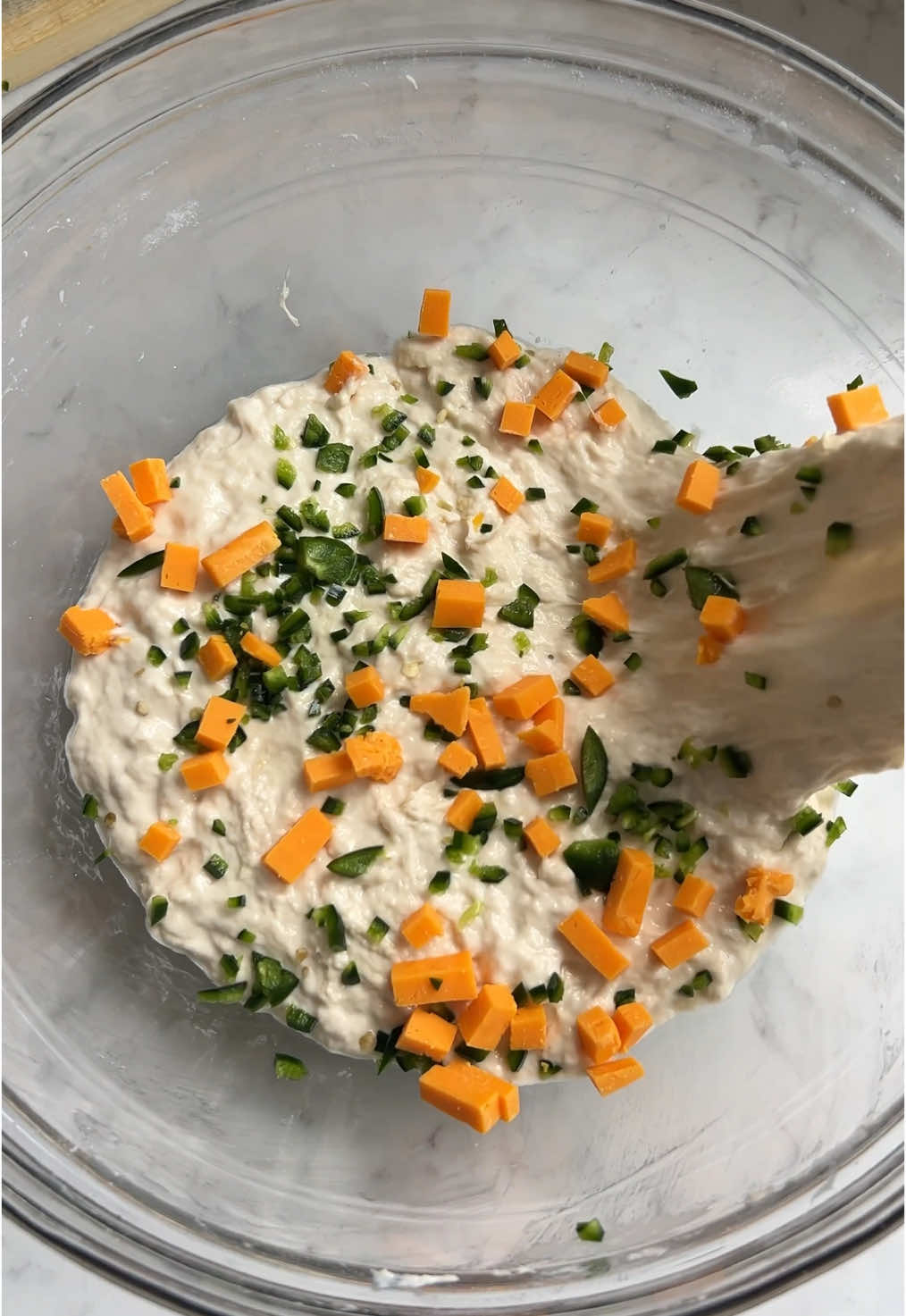 YOU JUST FOLD IT IN! 🧀 Anyone else have this #schittscreek audio in their head when they’re folding in the cheese?! Had to share this one today in memory of the legendary Catherine O’Hara 💔 But now to answer the ‘fold in the cheese’ question… 1. You can fold it in during the stretch and folds. Sprinkle grated or cubed cheese over the dough before you perform each set of stretch and folds - that will incorporate it nicely into the dough. I show this method here for my jalapeño & cheese focaccia sandwich rolls.   2. You can also stuff it into the middle of the focaccia. After you’ve transferred the dough into the tray you can sprinkle a layer of cheese into the dough before folding up into thirds to proof in the tray. This method is shown in the garlic butter & cheese stuffed focaccia clips in this video. 3. While this isn’t folding it in, you can of course sprinkle cheese over the top of the dough or press cubes of it into the dimples before baking. When I do this, I always add a little more cheese over the top about 12 minutes into the bake time so the cheese doesn’t burn to a complete crisp. The new cheese layered over the top protects the cheese that was dimpled in from the beginning so you’ll get some crispier areas and some gooier areas!  #catherineohara #foldinthecheese #focaccia #cheesestuffedfocaccia #schittscreek