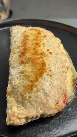 #VNVideoEditor                                          AMAZING HIGH-PROTEIN CHICKEN CALZONE. INGREDIENTS:                                  ●Ground chicken - 800 g ●Salt – 1 teaspoon ●Black pepper – to taste ●Smoked paprika – 1 teaspoon ●Cream cheese - 4 tbsp ●Cooked ham - 4 slices ●Tomato - 1, thinly sliced ●Mozzarella cheese -  150 g ●Olive oil - 1 tbsp. ●Grated Parmesan - 50 g 1. Preheat the oven to 392°F (200°C). Line a baking tray with parchment paper. 2. Spread the ground chicken evenly on the parchment paper, forming a thin oval or circle. Press it down firmly. 3. Season the chicken with salt, black pepper, and your favorite seasoning. 4. On one half of the chicken base, spread the cream cheese. Layer ham, tomato slices, and mozzarella on top. 5. Carefully fold the empty half of the chicken over the filling, creating a calzone shape. Gently seal the edges. 6. Brush the top with Olive oil and sprinkle generously with grated parmesan cheese. 7. Bake for 25-30 minutes, until golden, crispy on the outside, and fully cooked inside. 8. Let it rest for 3-5 minutes before slicing. ●Save the recipe● ●It's incredibly delicious and very simple!!!● Bon appetit! The recipe in your language is available in the description, 💖🇺🇦🇵🇱🇩🇪🇺🇸🇫🇰🇪🇸🇵🇹🇮🇹🇷🇴 🇷🇸🇭🇷🇱🇻🇸🇮🇨🇿🇫🇮🇸🇪🇩🇰🇳🇴 🇯🇵 🇬🇷 🇮🇱🇰🇿🇰🇬🇱🇻🇹🇼 🇵🇪 🇦🇷 🇨🇱 🇻🇪 🇹🇭 🇧🇷     #chickenbreastrecipe #chickenrecipes #calzone #simplydeliciousrecipes 