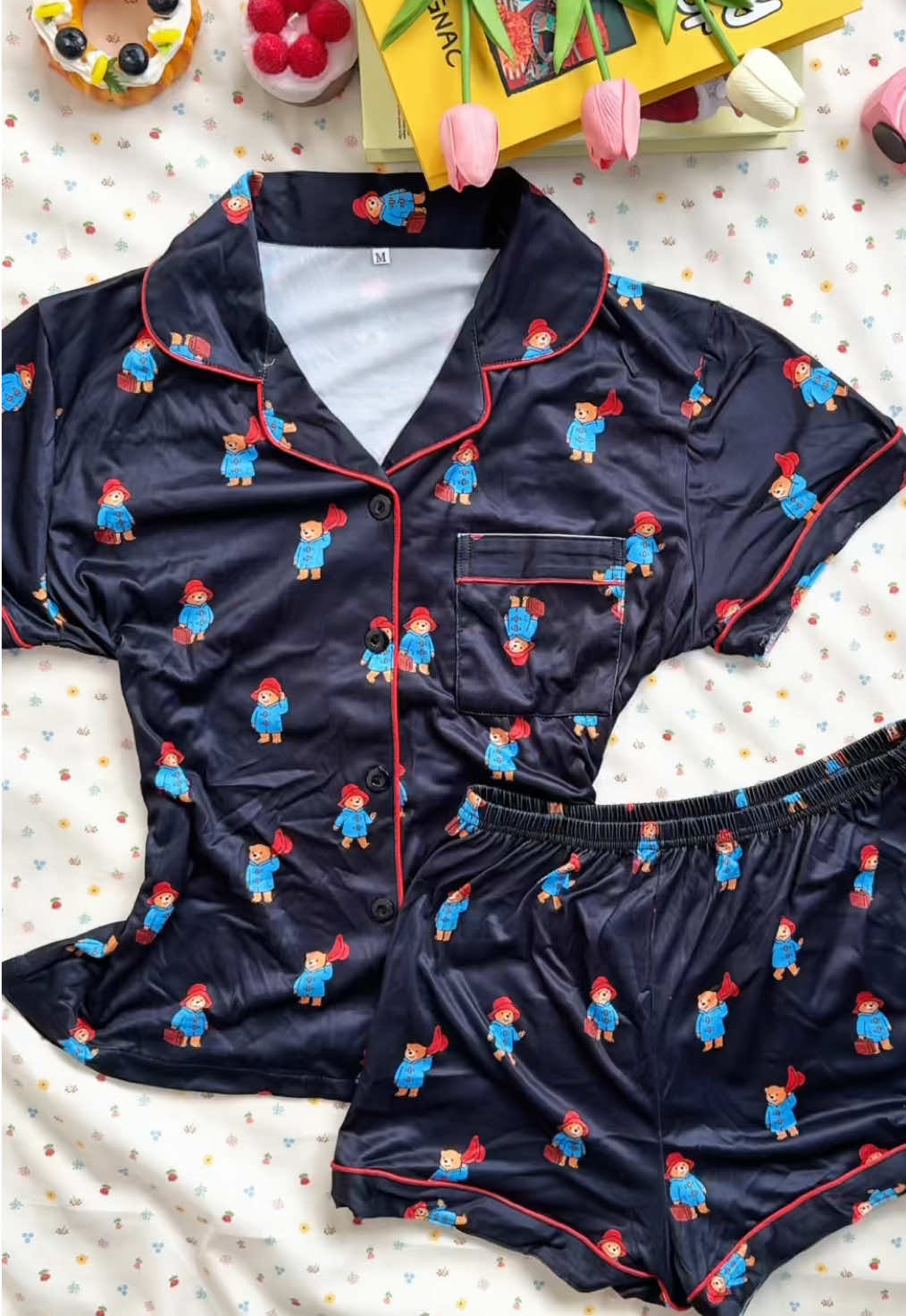 ✨ Retro charm meets cozy nights ✨ This navy blue satin pajama set is covered in the cutest little Paddington Bears — the glossy satin fabric feels luxe, and the red piping adds just the right pop of color. Perfect for lazy weekends, movie marathons, or even a cute sleepover with friends. 👉 Tap the link to grab yours before it’s gone! #satinpajamas #paddingtonbear #navypajamas #cutesleepwear #springfashion   