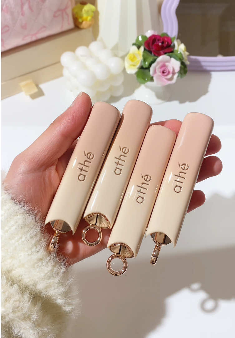 The glossiest Korean lip balms 💖 Athe Authentic Lip Glowy Balm ♡  The Authentic Lip Glowy Balm by Athe offers you a perfect glaze of candied hues with buildable intensity. This lip balm fills in fine lines and smooths dead skin, giving your lips a supple, radiant look with just one swipe. The moisturizing essence formula is 80% enriched with ceramides, glycerin, and squalane to keep your lips soft, while plant-derived borphyllin and vegan collagen ensure they remain plump, firm, and silky-smooth. My thoughts: The formula of these is just amazing 😍 I really like the sleek packaging and love that you can attach it to a keychain which makes it so convenient to carry around. They’re super smooth and glide on like butter. The colour looks subtle at first but intensifies after a few minutes. I love how moisturising and nourishing they feel and they keep my lips hydrated all day long! My fave shade is Flirt which is a pretty MLBB mauve 💕 What’s your fav shade?  #lipbalm #lipbalms #kbeauty #lipbalmreview #lipbalmaddict 