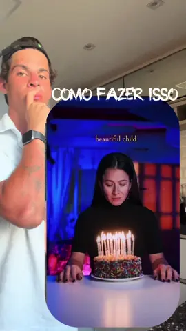 Transição da infância🔥 Prompt: Replace the adult person sitting near the birthday cake with the same person as a child use the provided childhood photo as reference). Keep the exact sitting position, body posture, and perspective the same as the original image. Keep the background, table, and cake completely unchanged. Change only the head and eye direction so the child is looking forward toward the camera instead of looking down at the cake. Adjust the head angle naturally so it matches a realistic forward-looking pose. Ensure the child blends seamlessly into the scene with correct proportions, lighting, and shadows. Maintain natural skin tone and accurate facial features from the reference image.