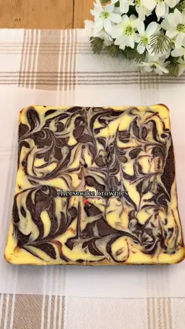 Fudgy Cheesecake Brownies 🍫🍰 (recipe makes an 8x8 pan) Ingredients: 10 tbsp (140g) unsalted butter, melted 1 cup (200g) granulated sugar ¼ cup (50g) brown sugar, packed  2 eggs, room temp 1 tsp vanilla extract ½ cup + 2 tbsp (56g) unsweetened cocoa powder ½ tsp salt 1 tbsp (13g) vegetable oil ½ cup (63g) all purpose flour, spooned & leveled or weighed (don’t pack it in) ¾ cup chocolate chips Cream Cheese Layer: 8 oz cream cheese, room temp ¼ cup (50g) sugar 1 egg ½ tsp vanilla  Instructions: Preheat oven to 325°F (163°C) and line/grease an 8x8-inch pan with parchment. In a large bowl, whisk melted butter, granulated sugar, and brown sugar until smooth. Add eggs and vanilla, then whisk vigorously for 1-2 minutes. Stir in cocoa powder and salt until fully combined. Mix in oil, then gently fold in the flour until just combined (don’t over mix). Fold in the chocolate chips. Spread most of the brownie batter into the prepared pan, reserving a little bit of it to swirl.  Beat cream cheese until smooth, add sugar and vanilla.  Gently mix in the egg.  Pour the cream cheese mixture over the brownie layer and dollop the reserved brownie batter on top. Swirl gently with a knife or chopstick. Bake at 325°F (163°C) for 30-40 minutes until edges are set and the center is still slightly jiggly.  Let it cool completely, then chill for at least 1 hour.  Enjoy!  #bakingrecipe #fudgybrownies #cheesecake #brownies #Recipe 