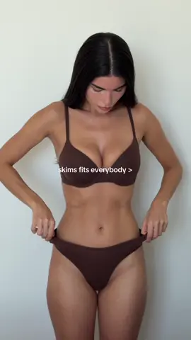 @aisha potter wears the skims fits everybody t-shirt bra and dipped front thong in cocoa