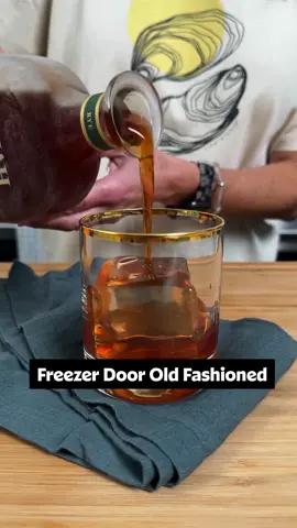 An icy glass of this Freezer Door Old Fashioned at the end of a busy day? It's a no-brainer! Get the full recipe details below or at the link in the @allrecipes bio. 🥃 🔗 Ingredients: 1 1/4 cups turbinado sugar 1 cup water 1 cinnamon stick (optional) 1 (750 ml) bottle bourbon or rye whiskey 1 ounce angostura bitters Orange peel and cherries for serving Directions: Combine sugar, water and cinnamon stick (if using) in a small saucepan.  Bring to a simmer, stirring often until sugar completely dissolves.  Let cool completely.  Pour a half cup of bourbon from the bottle and reserve for another use.  Pour 3 ounces of the prepared simple syrup into the bottle and reserve remaining syrup for another use.  Add bitters to the bottle and place the top on the bottle.  Gently tip the bottle over to mix the ingredients and place the bottle in the freezer for at least 6 hours.  To serve: pour 2-3 ounces over ice.  Add an orange peel and cherry and stir.  Allow the ice to slightly mellow and dilute the cocktail.  🎥: @NicoleMcLaughlin  #oldfashioned #cocktails #bourbon #freezerdoor 