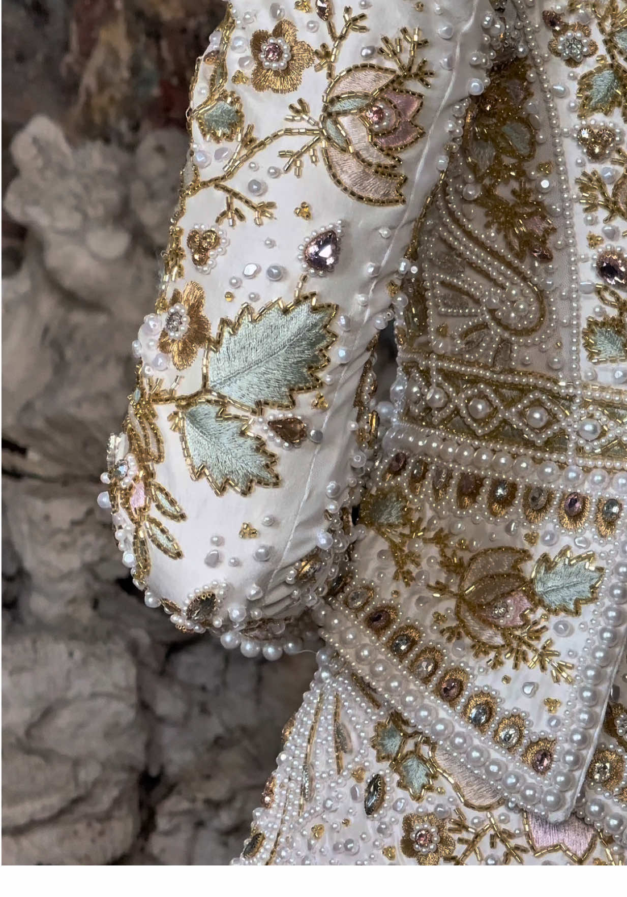 Unveiling the details on our new Juliet Jacket and skirt 🤍  Inspired by 18th-century botanical opulence, soft shades of rose and sage unfold through intricate embroidery, pearls and light-catching rhinestones, each detail outlined in gold to create depth and quiet radiance. #bridal #anniesibiza #bridaltiktok #wedding #weddingdress 