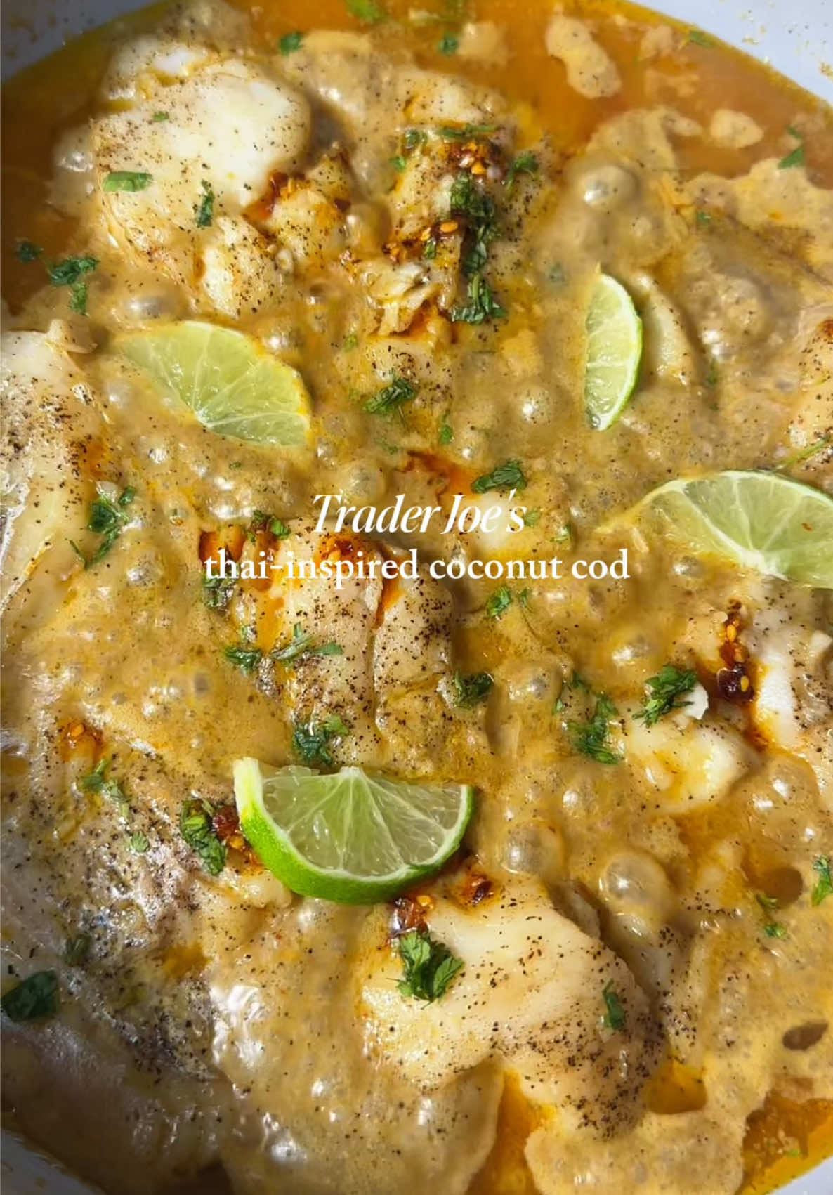 Trader Joe’s Thai-inspired coconut lime cod  Recipe:  1 lb of Alaskan cod, sliced  1 can coconut cream or milk 1 C Trader Joe’s Red style curry sauce 1 tsp lime zest 1 tsp lime juice 1/2 onion, sliced  2-3 garlic cloves, minced 1 tbsp of minced ginger  1/2 tbsp salt 1/2 tbsp pepper 1/2 tbsp sugar Salt & pepper to taste  Garnish with cilantro, lime, & red chili oil (shoutout to @Momofuku for sending me some) 1. Slice your cod into even pieces. Pat completely dry before seasoning them with salt and pepper. (Don’t judge my cutting, my knife’s are starting to get dull) 2. In a medium size sautee pan, I used my @onequince pan, drizzle in oil. Sear your cod both sized for about 30 sec-1 min each side. Remove.  3. Toss in more oil, add in your onion. Sautee until translucent before adding your garlic and ginger. Sautee for a couple of minutes then add in your coconut cream or milk, bring that into a low simmer.  4. Add in your Red Thai Curry sauce, lime juice, lime zest, & your seasonings. Bring to a low simmer.  5. Add in your cod. Cover and simmer on low for 5-10 minutes. Or until fish reaches an internal temp of 145F. Should be flaky and fall apart easily  6. Garnish with cilantro, lime, & chili oil.  7. Serve with white rice & enjoy <3 #traderjoesfinds #traderjoes #codrecipe #thaicoconut #EasyRecipe 