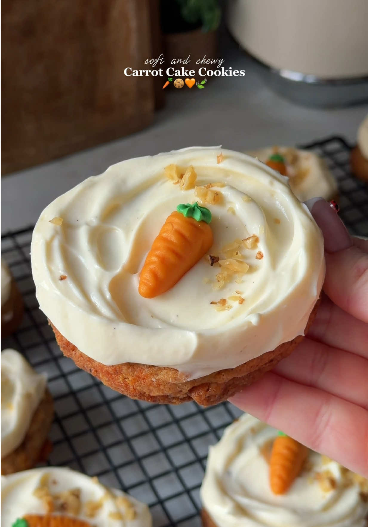 Brown Butter Carrot Cake Cookies 🧡🥕 (Makes 10) / Ingredients: For the cookies: - 180g unsalted butter (3/4 cup + 2 tablespoons) - 100g light brown sugar (1/2 cup) - 100g granulated sugar (1/2 cup) - 1 large egg + 1 large egg yolk - 1 teaspoon vanilla bean paste - 1/2 teaspoon baking soda - A pinch of salt - 1 teaspoon ground cinnamon - 220g all purpose flour (1 cup + 3/4 cup) - 85g finely crated carrots (3/4 cup) - 35g toasted walnuts, chopped up (1/4 cup) For the frosting: - 250g cream cheese (1 cup + 2 tablespoons) - 35g softened butter (3 tablespoons) - 100g granulated sugar (1/2 cup) - 100g whipping cream (1/2 cup) - 1 tsp vanilla extract or 1/2 teaspoon ground vanilla powder Instructions: 1. First, grate your carrots and squeeze out as much liquid as possible. Once you have slightly dry, shredded carrots, set them aside. 2. Now it’s time to brown the butter.  3. Add the cubed butter to a skillet or saucepan and let it melt over medium heat.  4. Stir constantly and let it cook until the milk solids turn brown and it smells slightly nutty. Be careful not to burn it. 5. Once ready, pour it into a large bowl and let it cool for about 15 minutes. 6. Once the brown butter has slightly cooled, add the granulated sugar and brown sugar and mix to combine. 7. Next, add the egg, egg yolk and vanilla bean paste. Mix until fully incorporated. 8. Then add the flour, baking soda and cinnamon. Fold gently until just combined. 9. Lastly, fold in the shredded carrots and walnuts. 10. Scoop 10 equal portions of cookie dough onto a baking tray lined with parchment paper.  11. Cover and place in the fridge for 1 hour to chill. 12. After an hour, preheat the oven to 180°C. 13. Place the cookies onto a large baking tray lined with parchment paper, leaving space between them. I recommend baking a maximum of 5 cookies per tray. 14. Bake in the preheated oven for 12 minutes. 15. Once baked, remove the cookies from the oven and place them on a wire rack. Let them cool completely before frosting. 16. While the cookies are cooling, prepare the frosting.  17. In a bowl, combine the sugar and butter until slightly creamy.  18. Then add the cream cheese and vanilla bean paste and mix until smooth. 19. Lastly, add the whipping cream and whip until slightly fluffy. 20. Once the cookies have cooled, scoop or pipe the frosting on top and enjoy. 21. For more tips visit my blog: www.welcometongskitchen.com / this recipe will be up in 2-3 days. #carrotcake #cookie #EasyRecipe #baketok #asmrsounds 