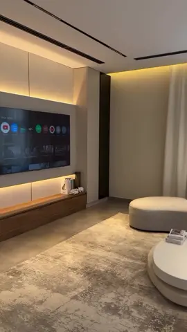 This living room is so clean 😮‍💨 Curved sofa Hidden lights Soft colors Luxury vibe This is how modern homes should feel. Would you want this setup? #LuxuryInterior #LivingRoomDesign #InteriorTok #ModernHome #MinimalLuxury     