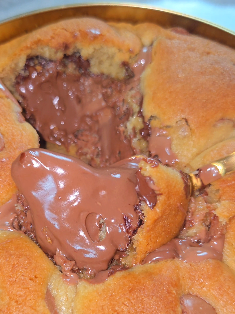 Nobody knows exactly how Granny came up with this cookie. Some say she was trying to make a classic chocolate chip and got a little carried away. Others say the Nutella jar accidentally fell into the plan and nobody had the courage to stop her. What we do know is this: warm buttery dough, melted chocolate chips, and a thick gooey Nutella center that turns the whole thing into a beautiful mess. Soft in the middle, golden on the edges, and just dramatic enough to make you cancel your self-control for the day. A little chaotic, very indulgent, and absolutely worth it. ❤️🍪🏠#cookies #cookiebox #fyp #nutella #cookie 