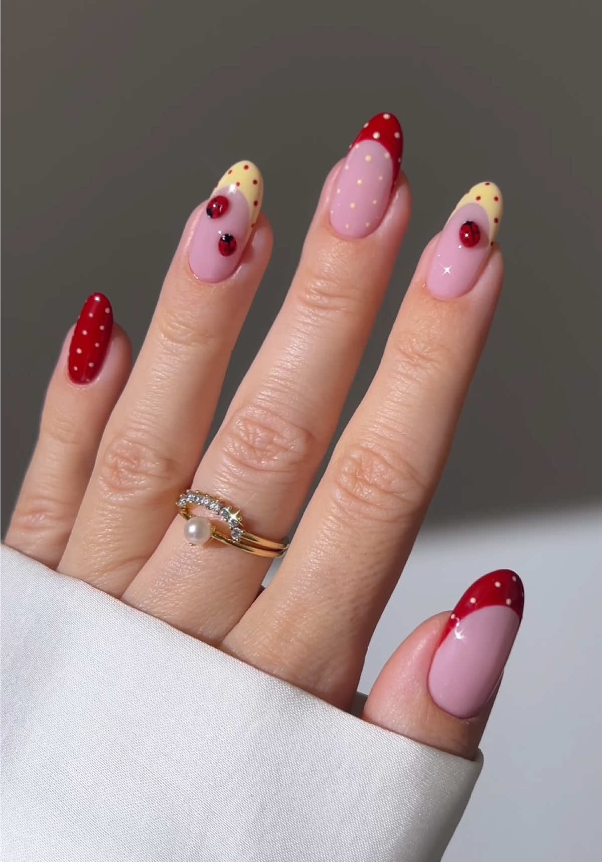 tiny dots, tiny bugs, big spring energy 🐞🌤️ •ad | using @Kiara Sky Professional Nails Pink Your Poison • Kiss Of Death • Starry Of My Life • True Black • 3D Flex Gel • High Shine Non-Wipe Top Coat • The Beyond Pro Vol. 3 Lamp • Discount code: AISTE #springnails #naildesign #nailtutorial #nailart #nailinspo pastel yellow red polka dot nails with ladybugs 