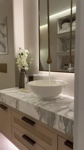 This bathroom looks so relaxing 😮‍💨 Warm lights Marble counter Clean design Luxury feeling This is how modern bathrooms should look. Would you want this at home? #LuxuryInterior #BathroomDesign #InteriorTok #ModernHome #SpaBathroom     