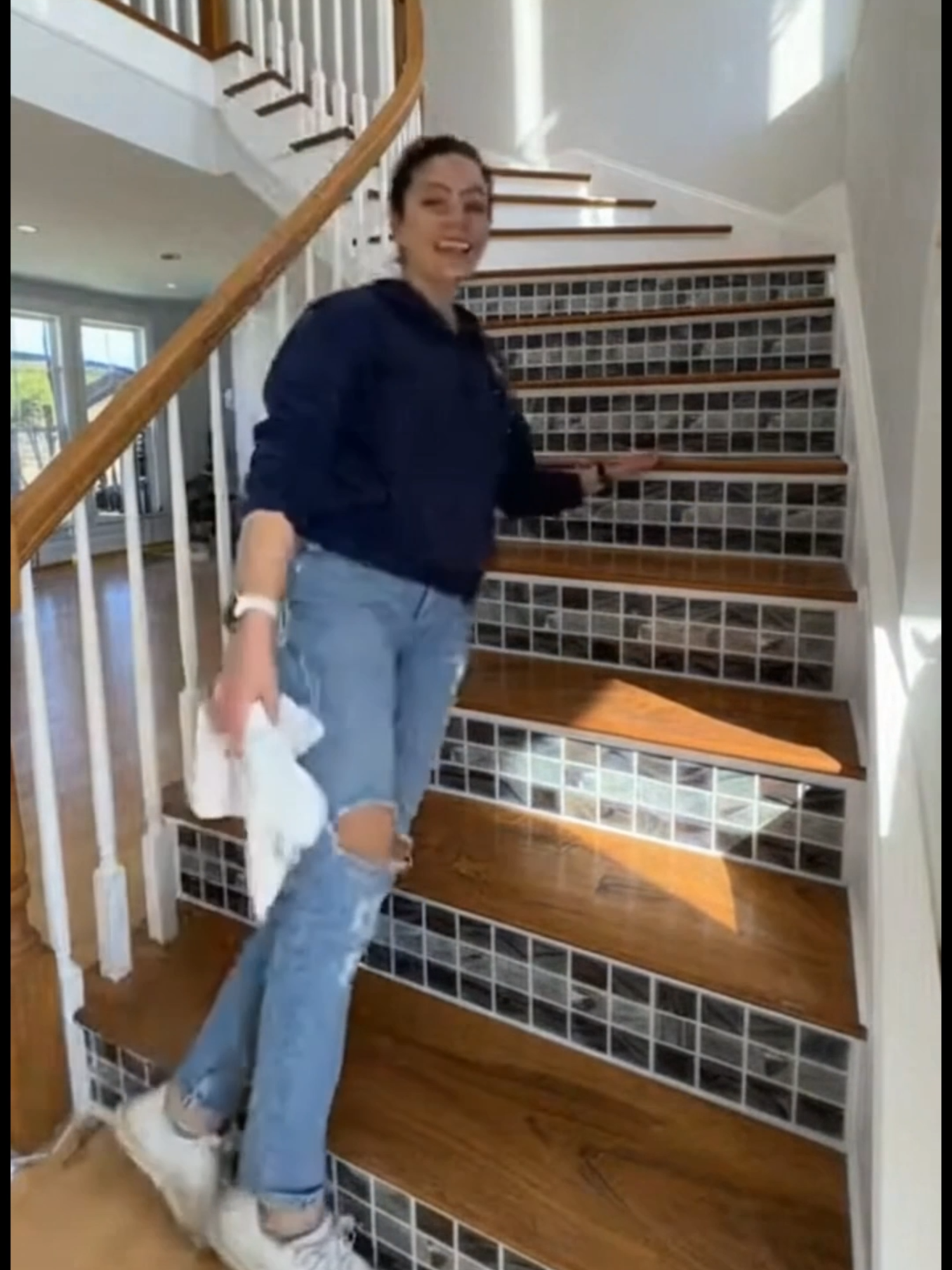 dark walnut treads + grey mosaic peel and stick stair risers + white railings = a combination that should not work as well as it does. 👀 #tile  #tiledesign #tileinstallation #homeimprovement #diyhomedecor