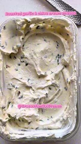 Roasted garlic & chive cream cheese 🩷 •1 garlic bulb  •Olive oil  •Salt •Chives  Preheat oven to 180°C.  Cut the top off of the garlic bulb exposing all of the cloves.  Place on a piece of tinfoil, cover in olive oil & wrap it up.  Place in the oven and cook for 45 minutes. Once golden & caramelised remove from the oven & allow to cool.  Once cooled squeeze the garlic cloves onto a plate & mash with a fork to make a smooth paste.  Add a pinch of salt & a handful of chopped chives. Mix into the garlic paste. Put your cream cheese into a glass container & add your garlic paste. Mix thoroughly.  Store in an airtight container & use within 5 days.  #Recipe #garlic #creamcheese 