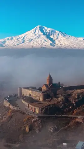 This has to be one of the most breathtaking sights in the world. Khor Virap monastery in Armenia, with the snow-capped Mount Ararat rising right behind it.    Otherworldly beauty! The site’s first chapel was built here in 642 AD, marking the beginning of what would later become the full monastery complex.  What we see today is largely from 1662, when it was rebuilt and expanded into the form that has endured through the centuries.  Beyond its beauty, Khor Virap is also one of Armenia’s most sacred places, known as the prison where Saint Gregory the Illuminator was held before the conversion of the Armenian kingdom to Christianity.  A landscape of otherworldly beauty layered with profound history. #landscape #Armenia #monastery #aroundtheworld #travel 
