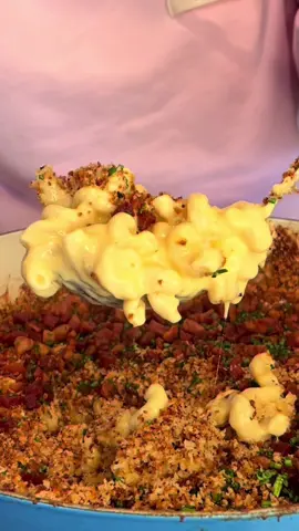 She calls this “swim meet pasta “because in the Pacific Northwest it’s freezing cold and you’re swimming outside in March so this is her go to request! This is basically your classic Baked Mac N Cheese with a crunchy Panko crust topped with crispy pancetta & chives! How can anyone go wrong! Crispy Pancetta Baked Mac & Cheese  Ingredients: – 1 lb pasta – 3 cups milk – 1 cup chicken broth – 1 (12 oz) can evaporated milk – 4 tbsp butter – ¼ cup flour – 3 cups sharp cheddar – 1–2 cups shredded mozzarella – 1 tbsp Dijon mustard – ½ tsp hot sauce (optional) – Salt & pepper – 1 cup panko breadcrumbs – 1 lb pancetta, diced – Fresh chives Instructions: 	1.	Cook pasta in salted water until al dente. Drain. 	2.	Melt butter, whisk in flour (1 min). Slowly whisk in milk, chicken broth, and evaporated milk until smooth. Simmer until thickened. 	3.	Stir in cheddar + mozzarella until fully melted. Add Dijon, hot sauce, salt & pepper. 	4.	Mix cheese sauce with pasta and transfer to a baking dish. 	5.	Top with panko (mix with a little melted butter for extra crunch). Bake at 400°F for 20–25 min until bubbly with a deep golden crust. Meanwhile, cook pancetta until crispy. Finish: ➡️ Remove mac & cheese from oven ➡️ Scatter crispy pancetta over the top ➡️ Sprinkle with fresh chives #bakedmacandcheese #macncheese #baked #crispy #loaded @Caraway Home @Le Creuset @Jacquemus  