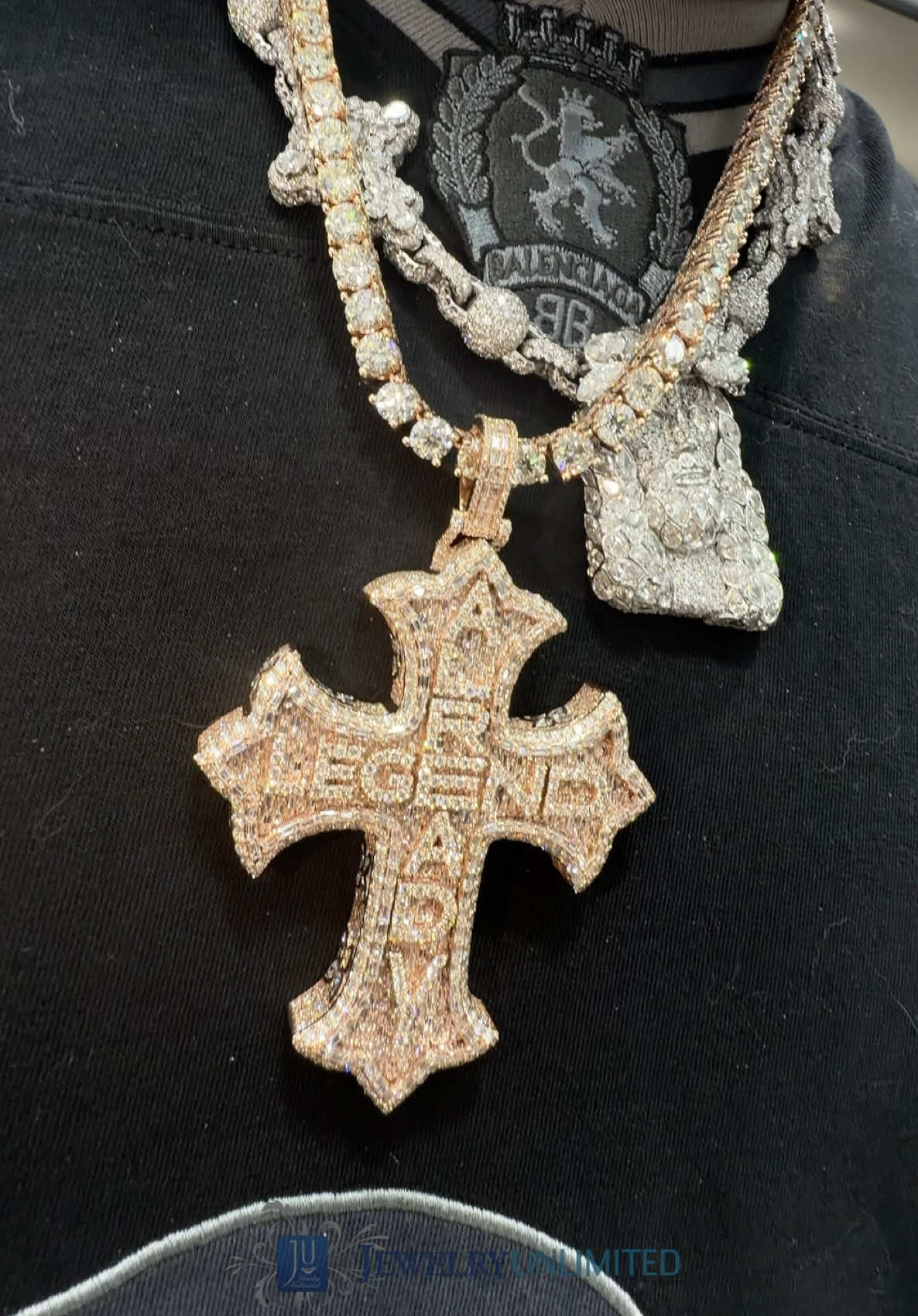 ALREADY. LEGEND. #yfnlucci ‼️ Fully iced-out emerald/round diamonds cross with bezel-set marquise stones on the side. Fit for a legend! 
