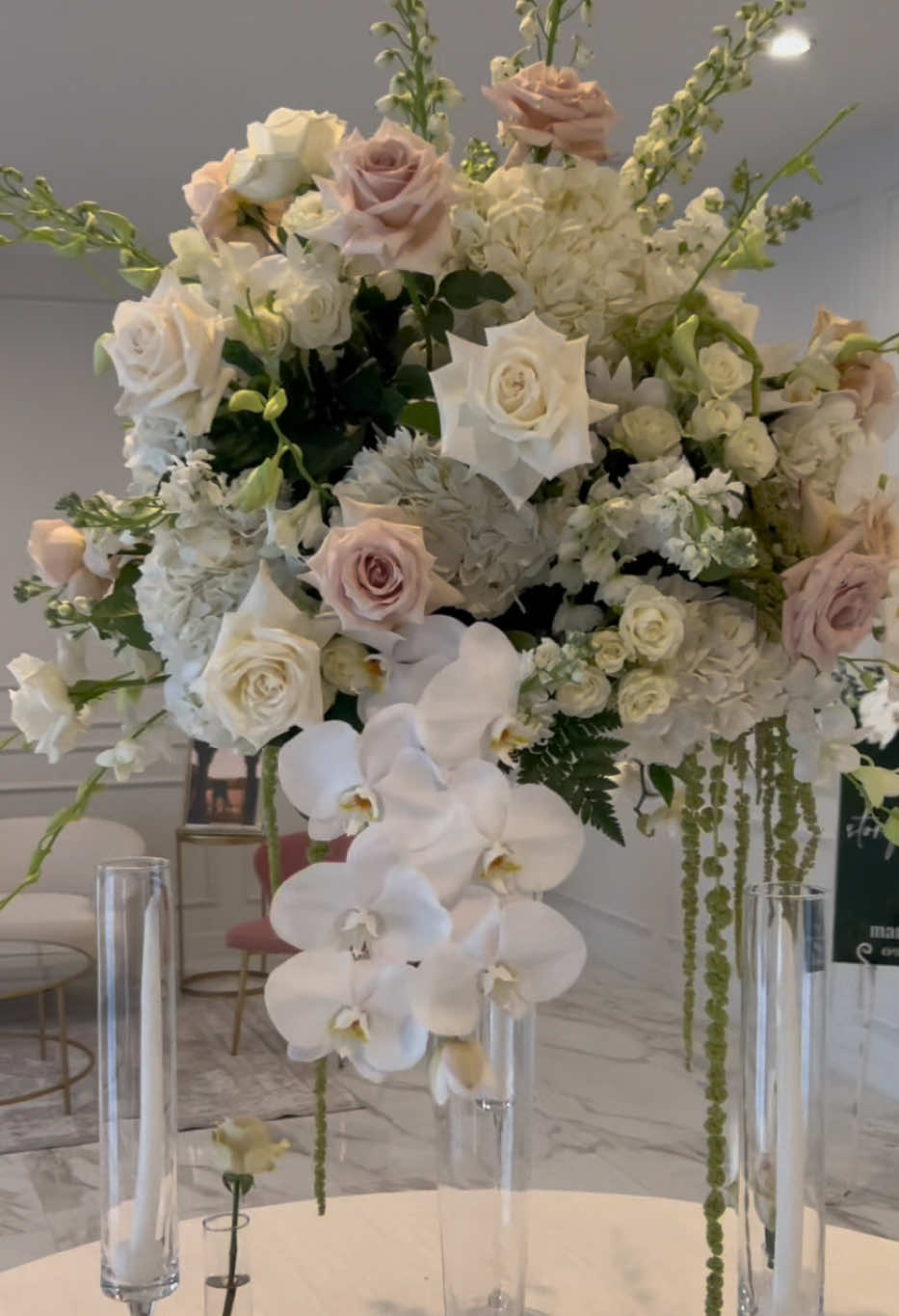 This is how you elevate your wedding tables 🤍✨ Tall crystal centerpiece with roses, hydrangeas, orchids & green hanging amaranthus for that perfect romantic and luxury look. 📍 Weston, FL 💬 DM us to design your wedding #WeddingFlowers #LuxuryWedding #TallCenterpiece #WeddingInspo #WestonFlorist