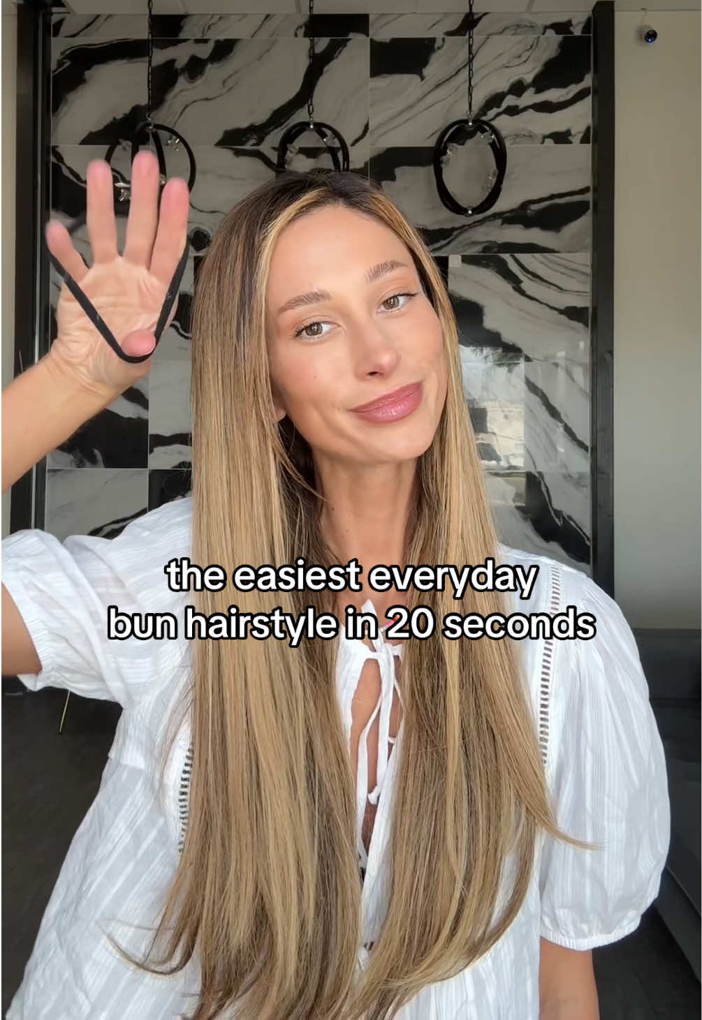 the perfect 20 second bun hairstyle using the Fringe Bang Hair Topper - these clip-bangs are the perfect hair accessory to instantly elevate even the most basic hairstyles!  Add curtain bangs, wispy bangs, or fringe bangs to your messy buns, slick back buns, up-do’s, etc.  The fringe bang hair topper is made with 100% premium human hair. it’s designed to look natural and blend in with your hair seamlessly! No one would ever know that you’re wearing one! it’ll look like you just left the salon!  They are super easy to clip on and go!  Shown in this video: 9” Fringe Bang Hair Topper in the color Medium Blonde with a rooting color service to add the darker roots! #easyhairstyles #messybun #hairtutorial #springhair #clipins 