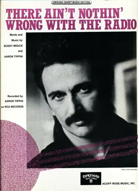 A beat-up car. A #1 hit. Aaron Tippin’s 1992 smash “There Ain’t Nothin’ Wrong with the Radio” wasn’t originally about a car at all — it was about a fictional girlfriend who kept messing with a guy’s radio. Co-writer Buddy Brock shut that idea down and insisted they write about Tippin’s actual beat-up vehicle, nicknamed Daisy, because the radio was literally the only thing on it that worked. That pivot to autobiography sent the song to #1 on the Billboard Hot Country chart, where it stayed for three straight weeks. “There Ain’t Nothin’ Wrong with the Radio” was released on February 10, 1992, as the lead single from Tippin’s second studio album, Read Between the Lines, on RCA Nashville. It debuted at #54 on the Billboard Hot Country Singles & Tracks chart on February 15, 1992, climbed to the top by April 18, and ranked #31 on Billboard’s 1992 Year-End Hot Country Songs chart. The album itself was certified Platinum by the RIAA — Tippin’s highest-certified studio release. Crank it up or change the station? #musicflashback 