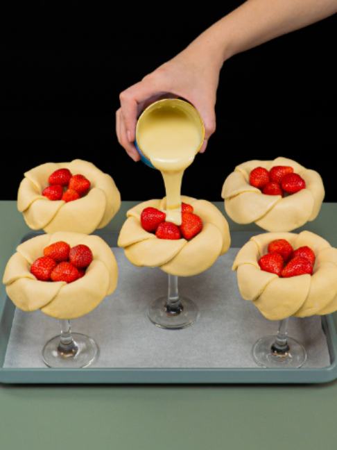 Puff pastry cake with strawberries, which amazes from the first moment. Ingredients puff pastry: 400 g (14 oz) strawberries: 300 g (11 oz) condensed milk: 50 g (1.8 oz) cheese cream: 300 g (11 oz) eggs: 2 pc strawberries: 300 g (11 oz) puff pastry: 300 g (11 oz) water: 20 ml (0.7 fl oz) sugar: 5 g (0.2 oz) strawberries: 300 g (11 oz) raspberry: 200 g (7.1 oz) sugar: 50 g (1.8 oz) lemon: 1 pc corn starch: 30 g (1.1 oz) water: 30 ml (1.0 fl oz) cheese cream: 400 g (14 oz) powdered sugar: 100 g (3.5 oz) whipping cream: 600 ml (20 fl oz) puff pastry: 200 g (7.1 oz) Sauce flour: 8 g (0.3 oz) powdered sugar: 10 g (0.4 oz)