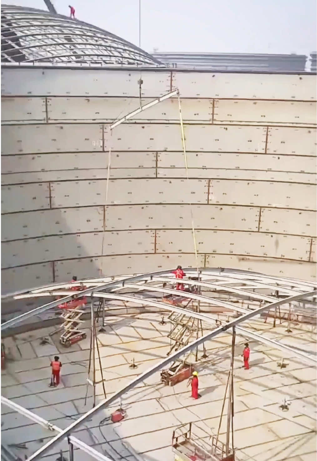This video changes your sense of scale. At first, you see workers assembling the steel dome roof of a 50,000m³ fixed roof storage tank. It already looks enormous. Then the camera turns. And you realize it is only one tank inside a massive tank farm. Around it are more 50,000m³ petroleum storage tanks and 100,000m³ double-deck floating roof crude oil tanks. These are the storage systems that support refineries, oil terminals, strategic petroleum reserves, and energy infrastructure projects. Most people will never have the opportunity to stand here. That is why I wanted to share this view. #API650 #TankFarm #StorageTank #CrudeOilTank #manufacturing 