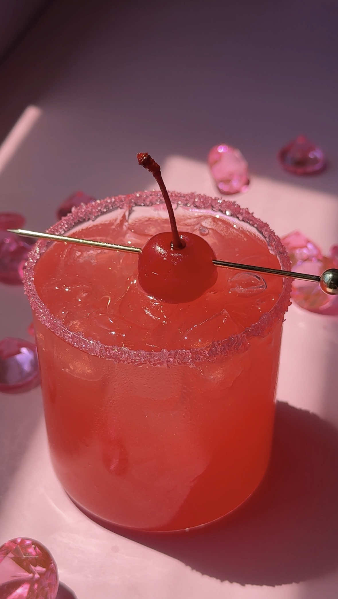 This is your sign to make a Bend & Snap cocktail for the ‘Legally Blonde’ prequel series, ‘Elle’. 🍸💅 -2 oz. coconut rum -1 oz. cranberry juice -1 oz. orange juice -1 oz. pineapple juice -splash of grenadine -edible pink glitter -agave & pink sugar for rim -maraschino cherry for garnish #legallyblonde #elle #cocktails #shows #prime