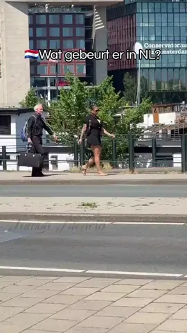 🇳🇱 Just another day in Amsterdam 🤣 Is this what we call normal now?  Woman seen walking an older man by a leash. #nederland #suriname #travel #funny #comedy 